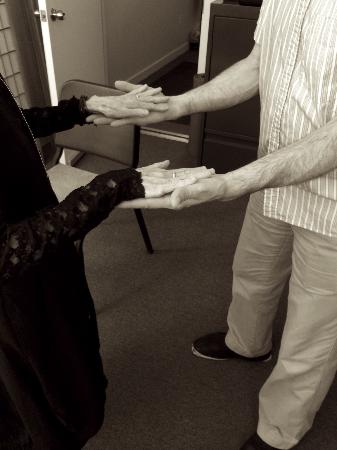 Activity with hands...exerting a little pressure down onto hands while lengthening and widening the back...the other set of hands resists...